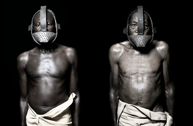 black slaves wearing metal face masks